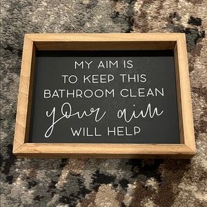 Black and Brown Bathroom Sign